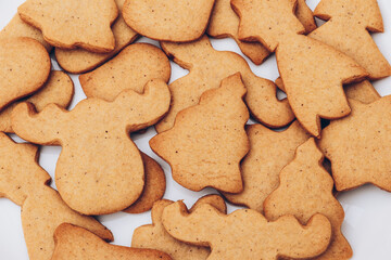 Tasty Christmas gingerbread cookies on the white plate.