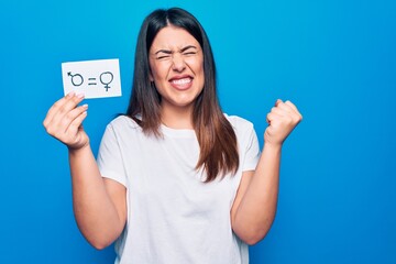 Beautiful woman asking for sex discrimination holding paper with gender equality concept screaming...