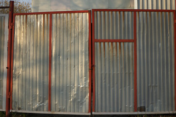 Metal gates. Hangar entrance. Stainless steel gate. Large garage.