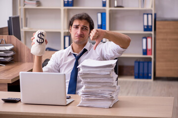 Fototapeta premium Young male employee in remuneration concept