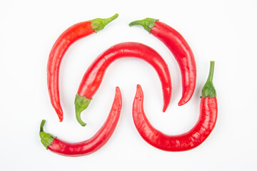 Red hot chili peppers over white background. Vitamin vegetable food