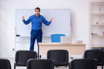 Young male business trainer making presentation during pandemic