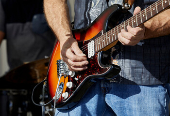 Obraz premium Musician's Hands playing and Electric Guitar