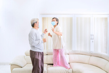 Elderly couple dancing during quarantine at home