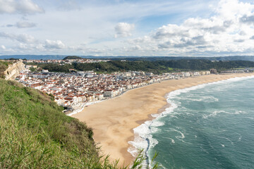 view from the viewpoint of Nazaré beach, at sunrise, in Portugal.