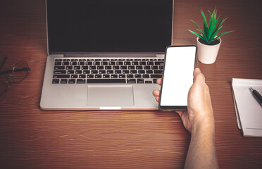 Working from home by laptop computer and smartphone