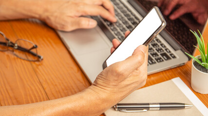 Working from home by laptop computer and smartphone