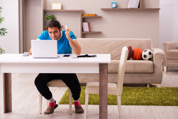 Sport bet addicted young man betting at home