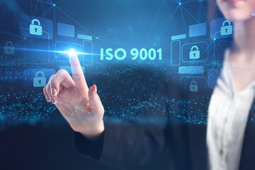 Business, Technology, Internet and network concept. Young businessman working on a virtual screen of the future and sees the inscription: ISO 9001