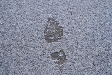 Footprint of shoes, boot on white snow.