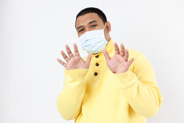 Asian man in a protective mask on white background