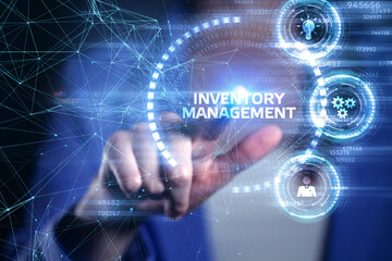 Business, Technology, Internet and network concept. Young businessman working on a virtual screen of the future and sees the inscription: Inventory management