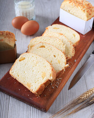 Slice Homemade Hokkaido Milk White Bread (Japanese Brioche) with Cheese on Wooden Board, Served with Egg and Milk