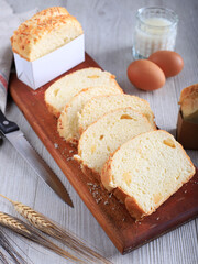Slice Homemade Hokkaido Milk White Bread (Japanese Brioche) with Cheese on Wooden Board, Served with Egg and Milk