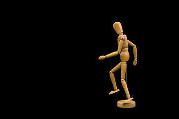 Wooden dummy walking. Template for drawing, arts and animation. Black background.