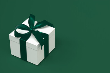 white gift box 3d with green ribbon and bow on green background