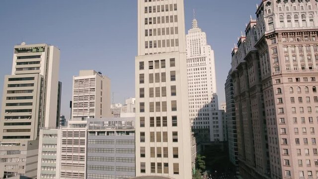 Aerial view of the Martinelli and the Santader Buildings, sunny day, in Sao Paulo, Brazil - tracking, drone shot
