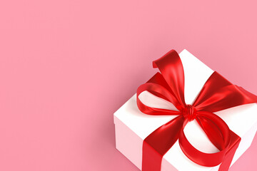 White gift box 3d with red ribbon and bow on pink background