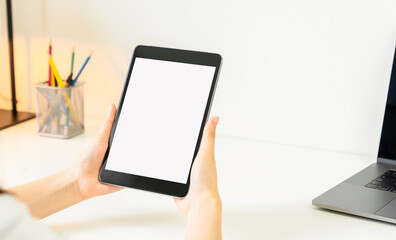 Woman hand using digital tablet and the screen is blank.