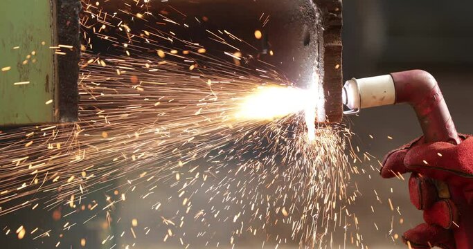 Sparks From A Blow Torch Cutting Rusty Steel In Slow Motion - close up