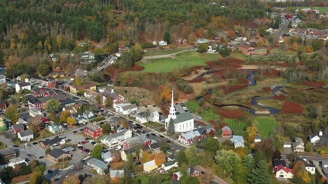 Aerial View of Stowe. Vermont USA. City Downtown, Community Church and Colorful Landscape on Sunny Autumn Day, Drone Shot