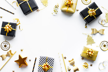 Merry christmas,xmas and new year celebration concepts with gift box and ornament in black and golden color on white background