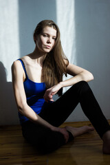 portrait of a woman with brown hair in blue shirt