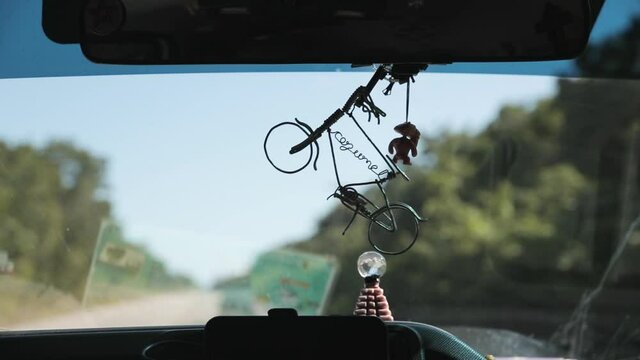 knick knack hanging on car rearview mirror 60fps