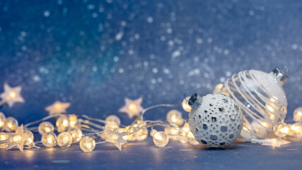 festive new year and christmas background with glass balls and glowing holidays lights
