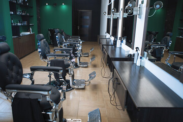 Barbershop interior in green tones.