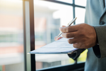 Business men give a pen to sign a contract Business people sign documents