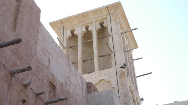 Wind Tower With Installed CCTV In The Historic Neighborhood Of Al Fahidi In Dubai, UAE. - Low Angle Shot