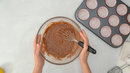 Chocolate muffins recipe. Whisk the wet ingredients into the dry ingredients, mixing muffin batter