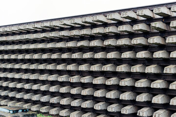 Huge pile of cement rail road  sleepers.