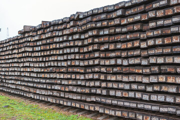 Huge pile of used oaken rail road  sleepers.