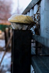 flashlight in the fence post