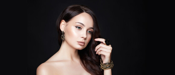 pretty young brunette woman with jewelry