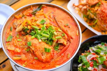 Tom yam Kung.Hot and sour seafood soup.Thai food in restaurant.Red chilli.Shrimp in a bowl.