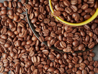 Coffee beans and hot coffee on the table