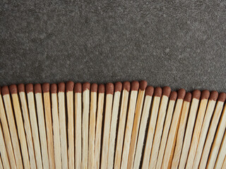 Matchbox with bright colorful matches isolated on a black background