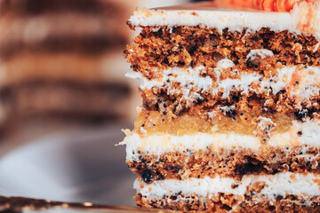 Slit cake on a white plate with a fork. Sweets for any holiday. Piece of cake on a white plate