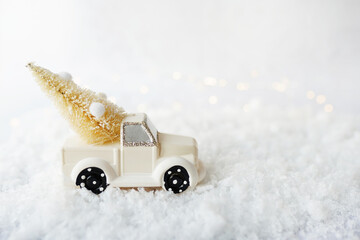 christmas car with tree on white snow bokeh background