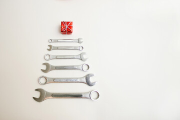 Wrenches stacked in a christmas tree shape on white background