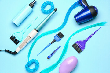 Set of hairdresser's tools on color background