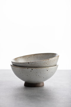 handmade ceramics, empty craft ceramic bowls on light background 