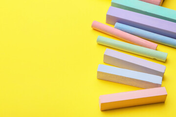 Colorful chalks on color background