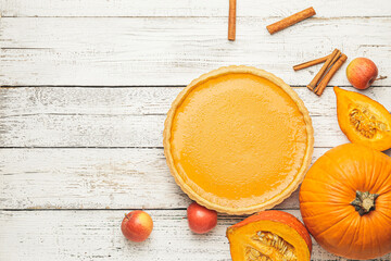 Composition with tasty pumpkin pie on wooden background