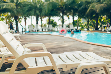Obraz na płótnie Canvas Lounge chairs near the pool at the hotel.