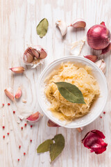 Organic sauerkraut (pickled cabbage) with onions, garlic and spices