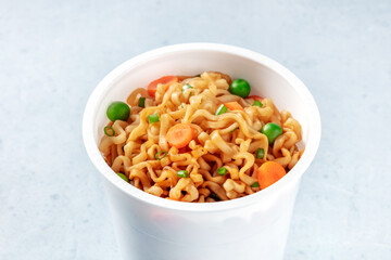 Ramen cup. Instant noodles close-up. Asian vegan fast food lunch